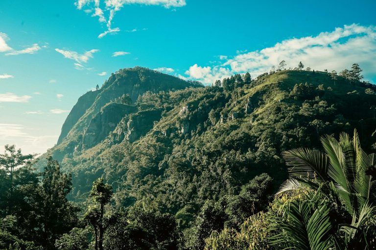 Ella Rock rising above green hills near Ella, Sri Lanka