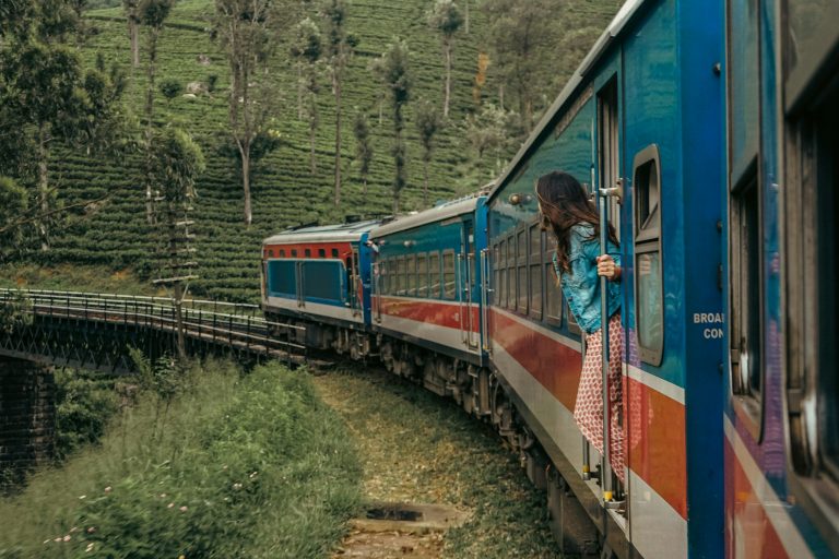 Train curving through green tea country near Ella, Sri Lanka