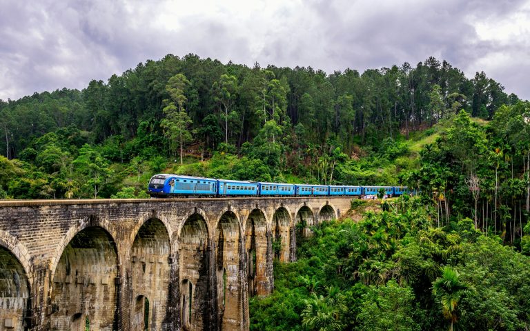 Train crossing the stone arches of the Nine Arch Bridge near Ella, Sri Lanka