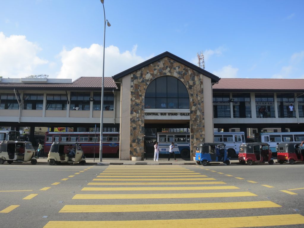 Front of the Central Bus Stand in Galle, with buses inside and tuk-tuks parked on the road in front