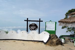 The Lipton's Seat lookout with its welcome sign and estate history board, above a sea of cloud