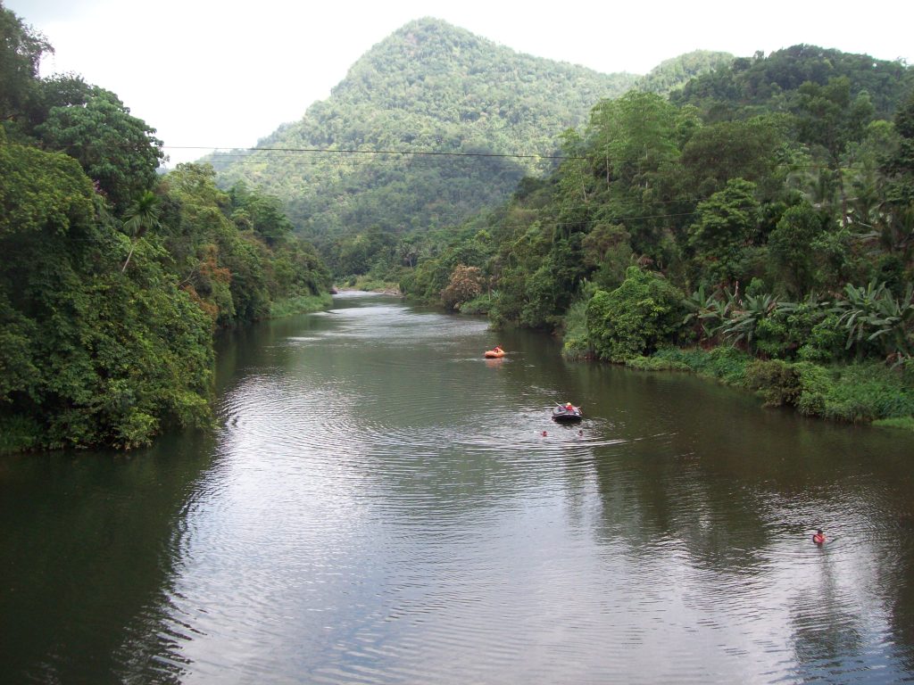 The Kelani River at Kitulgala with a suspension bridge crossing it, forest on both banks